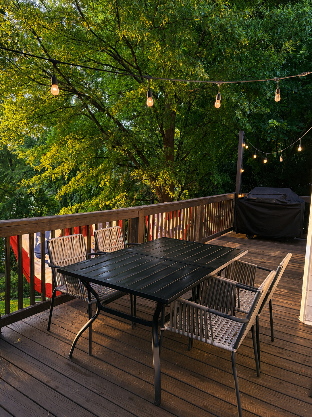 Outdoor deck with string lights at the Lake Sinclair retreat in Georgia